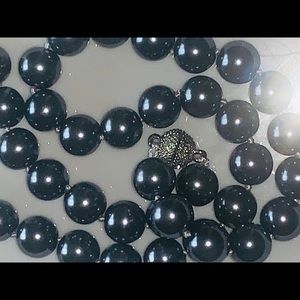 Brand new metallic black south sea shell pearl